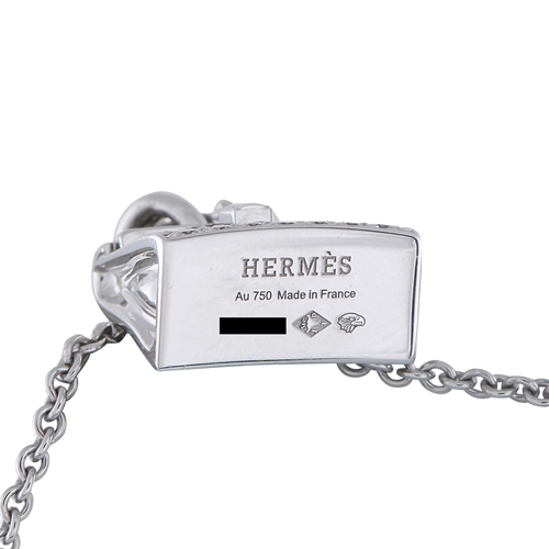 422 - A Hermes Amulettes Birkin 18K White Gold Diamond Pendant Necklace. A Birkin pendant takes center sta... 