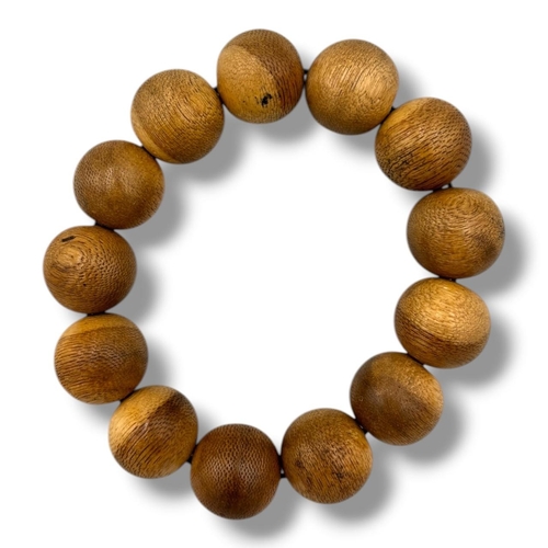 1192 - A Natural Agarwood polished round Bead Bracelet. 
The natural agarwood fragrance is well known for i... 