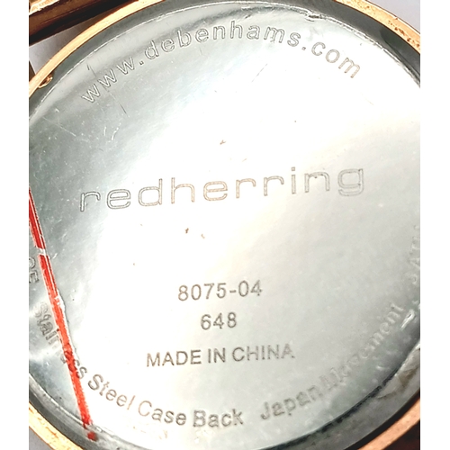 1064 - A PAIR OF LADIES WRISTWATCHES. A RED HERRING, ROSE GOLD TONE, MESH BRACELET WATCH AND A LAURA ASHLEY... 