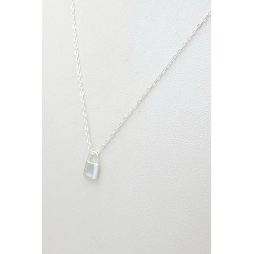 1155 - A STERLING SILVER PADLOCK PENDANT ON CHAIN ALONG WITH ANOTHER STERLING SILVER KEY PENDANT ON CHAIN. ... 