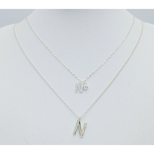 1196 - A PAIR OF STERLING SILVER NECKLACES WITH INITIAL N PENDANTS. ONE IS STONE SET. TOTAL WEIGHT 2.7G. A/... 