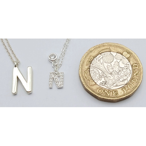 1196 - A PAIR OF STERLING SILVER NECKLACES WITH INITIAL N PENDANTS. ONE IS STONE SET. TOTAL WEIGHT 2.7G. A/... 