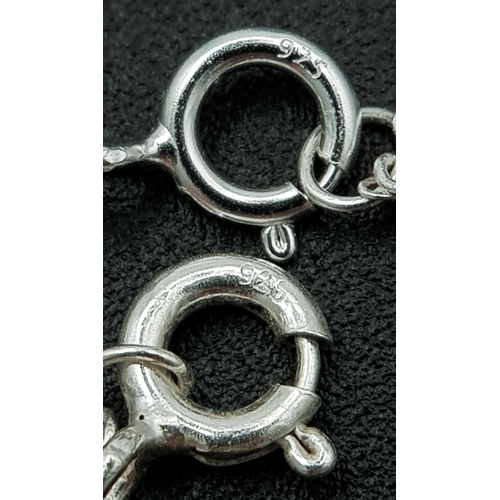 1203 - A PAIR OF STERLING SILVER NECKLACES WITH INITIAL R PENDANTS. ONE IS STONE SET. TOTAL WEIGHT 2.6G. A/... 