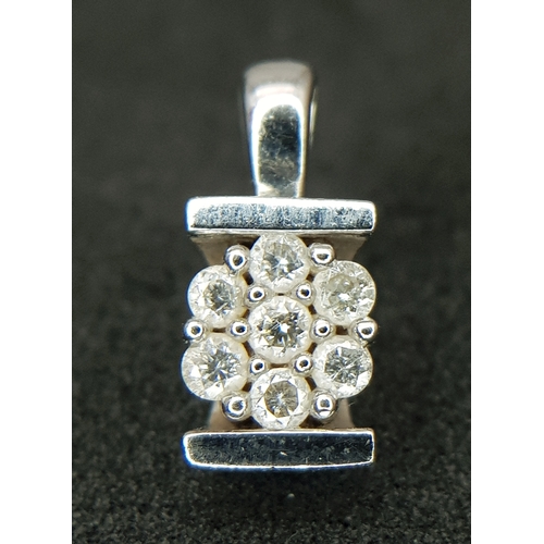 1204 - A Pretty 9k White Diamond Set Pendant. 1.6cm Length. Set with Seven Round Cut Diamonds, total 0.13 c... 