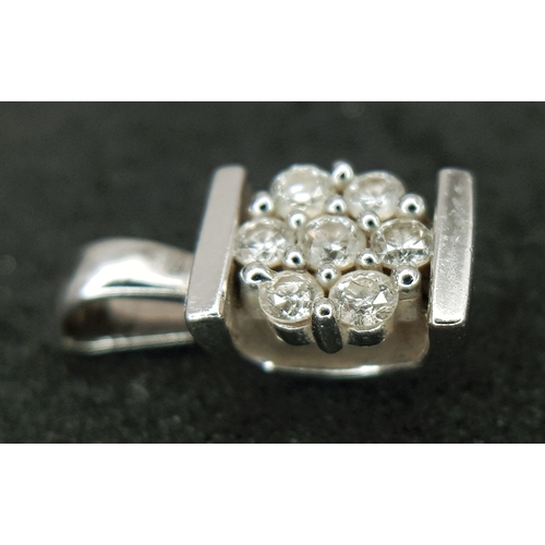 1204 - A Pretty 9k White Diamond Set Pendant. 1.6cm Length. Set with Seven Round Cut Diamonds, total 0.13 c... 