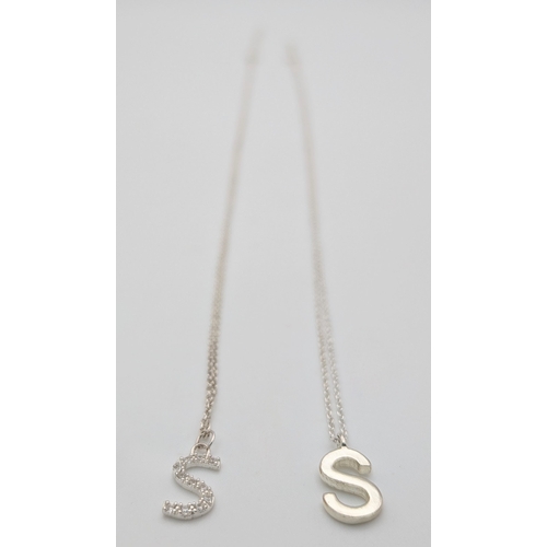 1210 - A PAIR OF STERLING SILVER NECKLACES WITH INITIAL S PENDANTS. ONE IS STONE SET. TOTAL WEIGHT 2.9G. A/... 
