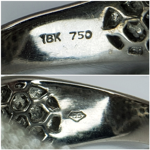 29 - An 18K White Gold Diamond Statement Ring. Abstract crossover form with c.4ctw of round brilliant cut... 