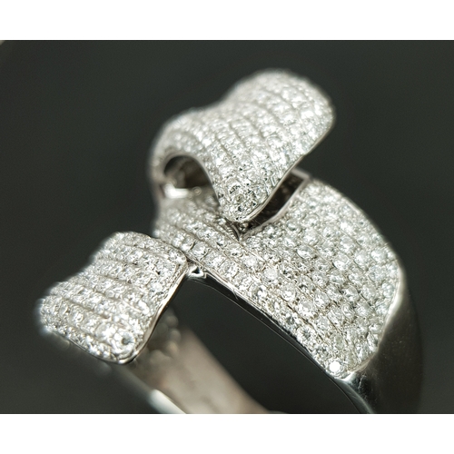 29 - An 18K White Gold Diamond Statement Ring. Abstract crossover form with c.4ctw of round brilliant cut... 