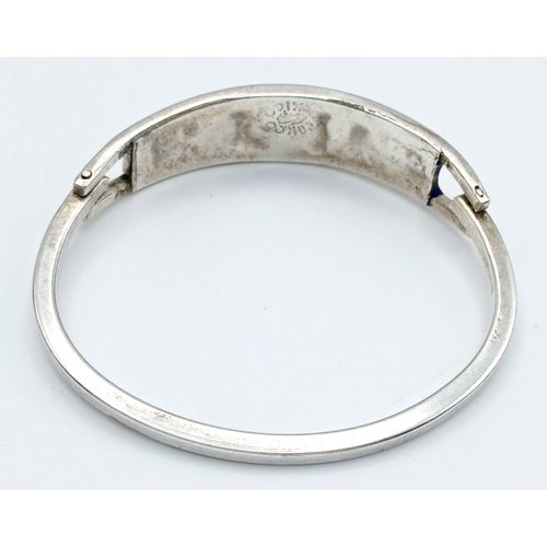 176 - A Mexico Silver Bangle with Blue Enamel and Mother of Pearl Floral Decoration. Approx 5.5cm diameter... 