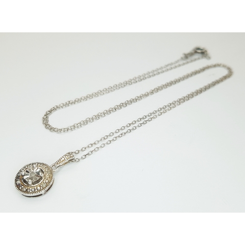 169 - A 925 Sterling Silver Necklace with Round Crystal Set Pendant. Approx 46cm length, pendant drop 1.5c... 