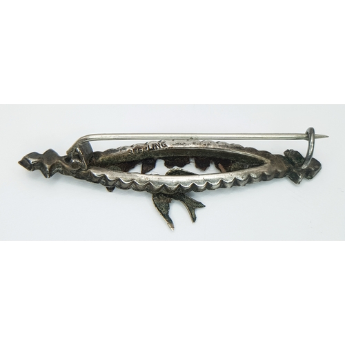 131 - A vintage sterling silver Flroal and Bird design brooch. Total weight 2.2G. Total length 5.5cm