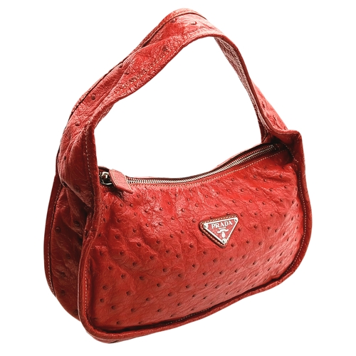 124 - A Red Prada Ostrich Effect Leather Crossbody Bag. Red ostrich effect leather exterior with silver-to... 