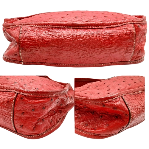 124 - A Red Prada Ostrich Effect Leather Crossbody Bag. Red ostrich effect leather exterior with silver-to... 
