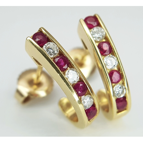125 - A PAIR OF 18K YELLOW GOLD, DIAMOND AND RUBY SET DROP EARRINGS. TOTAL WEIGHT 3.4G. TAN 9003
