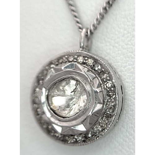 137 - A Platinum 0.5ct Centre Diamond Halo Pendant on a 9K White Gold Chain Necklace. The Centre Diamond o... 