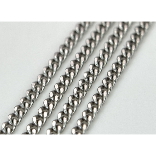137 - A Platinum 0.5ct Centre Diamond Halo Pendant on a 9K White Gold Chain Necklace. The Centre Diamond o... 