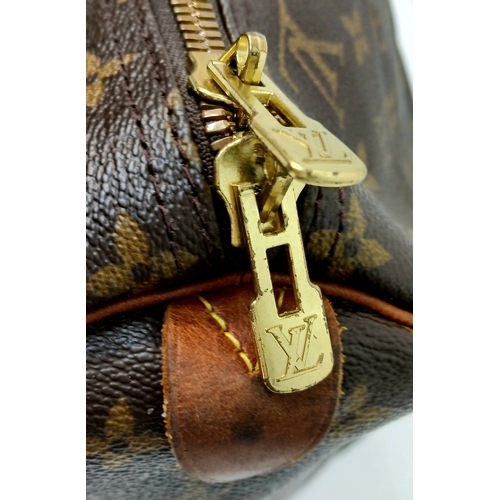 138 - A Brown Louis Vuitton Monogram Keepall 60 Travel Bag. Brown monogram coated canvas exterior with vac... 