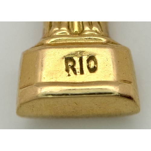 143 - An 18K Yellow Gold (tests as) Christ the Redeemer Pendant. 3.5cm. 3.15g.