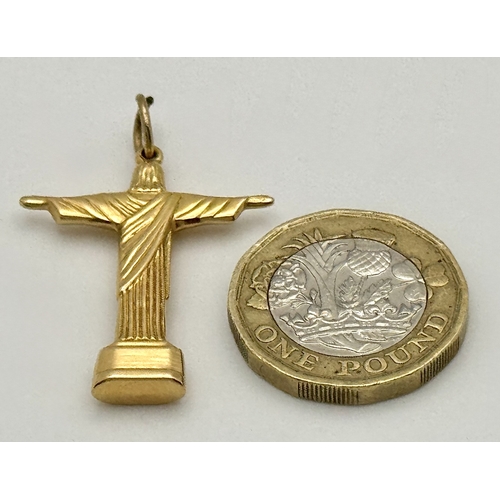 143 - An 18K Yellow Gold (tests as) Christ the Redeemer Pendant. 3.5cm. 3.15g.