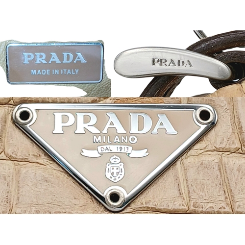 145 - A Prada Croc-Embossed Leather Shoulder Bag. Beige leather exterior with silver-tone Prada logo plaqu... 