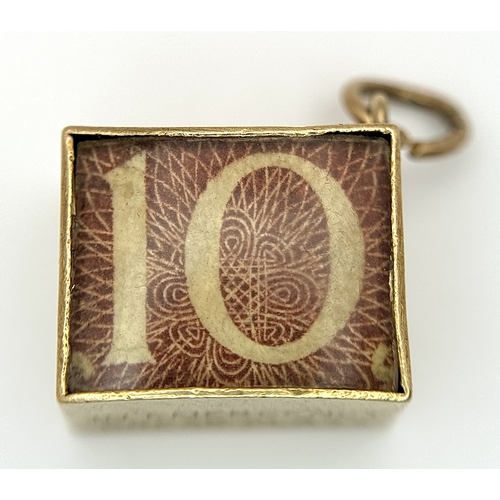 154 - Vintage 9 CARAT GOLD,  TEN SHILLING NOTE, GOLD CASED CHARM. Full UK hallmark. 2.7 Grams Gross.