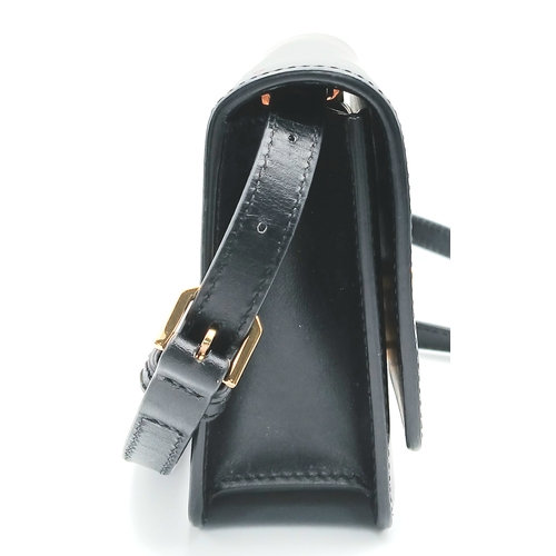 159 - A Burberry Black Leather TB Crossbody Bag. Smooth black leather exterior with gold-tone hardware, ad... 