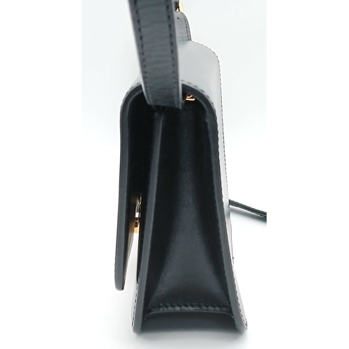159 - A Burberry Black Leather TB Crossbody Bag. Smooth black leather exterior with gold-tone hardware, ad... 