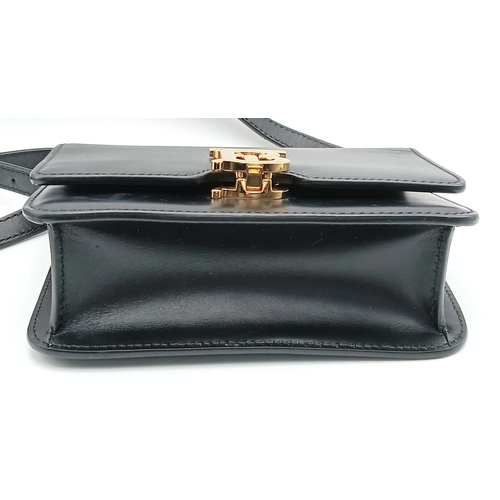 159 - A Burberry Black Leather TB Crossbody Bag. Smooth black leather exterior with gold-tone hardware, ad... 