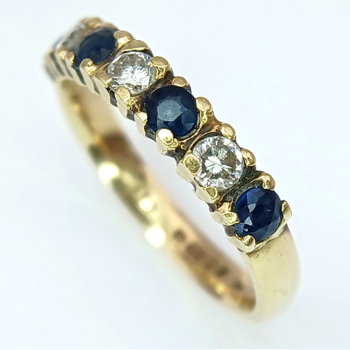 161 - Classic 18 CARAT GOLD, SAPPHIRE and DIAMOND, 7 STONE RING. Full UK hallmark. 3.35 Grams. Size L 1/2 ... 