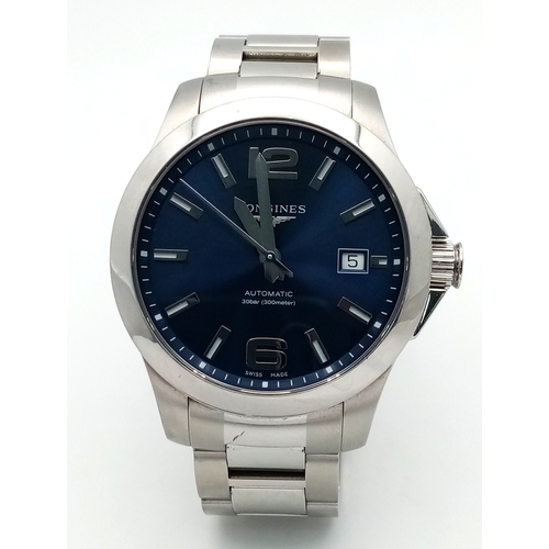 163 - A Longines Conquest Automatic Gents Watch. Stainless steel bracelet and case - 39mm. Navy blue dial ... 