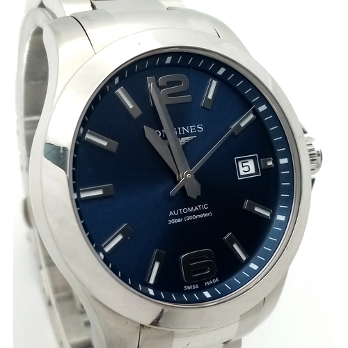 163 - A Longines Conquest Automatic Gents Watch. Stainless steel bracelet and case - 39mm. Navy blue dial ... 