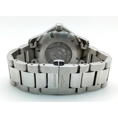 163 - A Longines Conquest Automatic Gents Watch. Stainless steel bracelet and case - 39mm. Navy blue dial ... 