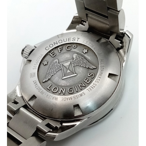 163 - A Longines Conquest Automatic Gents Watch. Stainless steel bracelet and case - 39mm. Navy blue dial ... 