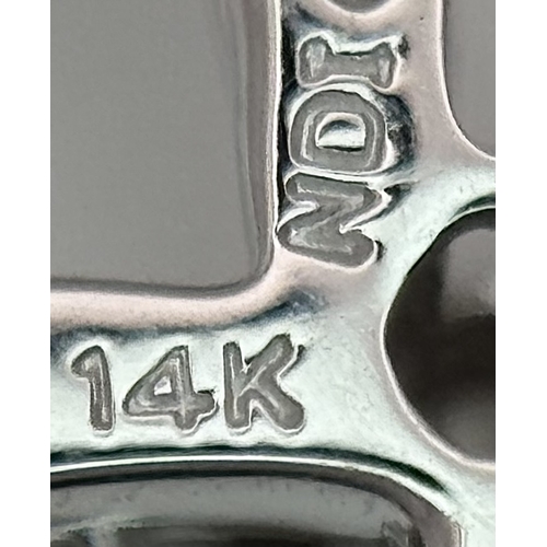 241 - A 14K White Gold Diamond Cross Pendant. c.0.60ctw of round brilliant cut diamonds having G-H colour ... 