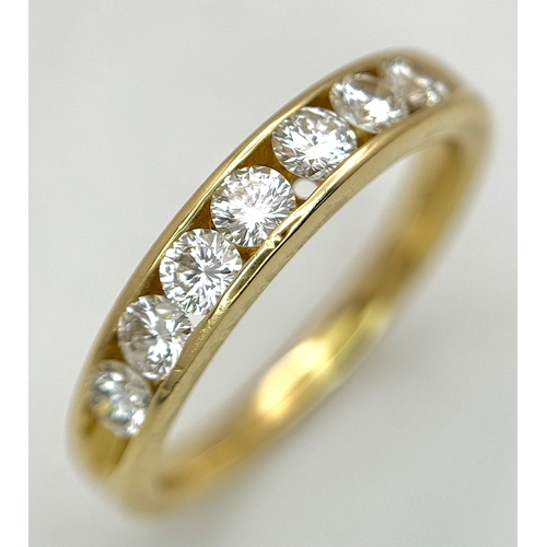 34 - AN 18K YELLOW GOLD, DIAMOND SET, HALF ETERNITY RING. 0.70CTW. 3.9G, SIZE M. SC 1077