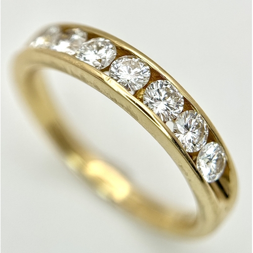 34 - AN 18K YELLOW GOLD, DIAMOND SET, HALF ETERNITY RING. 0.70CTW. 3.9G, SIZE M. SC 1077
