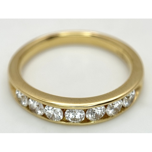 34 - AN 18K YELLOW GOLD, DIAMOND SET, HALF ETERNITY RING. 0.70CTW. 3.9G, SIZE M. SC 1077