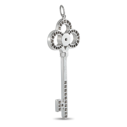 134 - A Platinum 0.64ct Diamond  Tiffany & Co. Crown Key Pendant. Crafted from Platinum, pav Diamonds with... 
