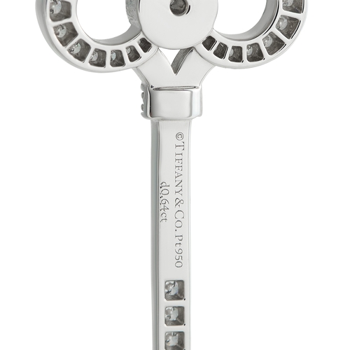134 - A Platinum 0.64ct Diamond  Tiffany & Co. Crown Key Pendant. Crafted from Platinum, pav Diamonds with... 