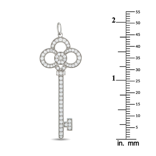 134 - A Platinum 0.64ct Diamond  Tiffany & Co. Crown Key Pendant. Crafted from Platinum, pav Diamonds with... 