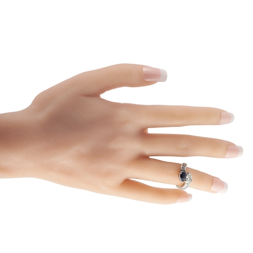 166 - A  Platinum 1.30ct Diamond and Sapphire Ring.  0.95 carat pear-shaped Diamond is perfectly paired wi... 