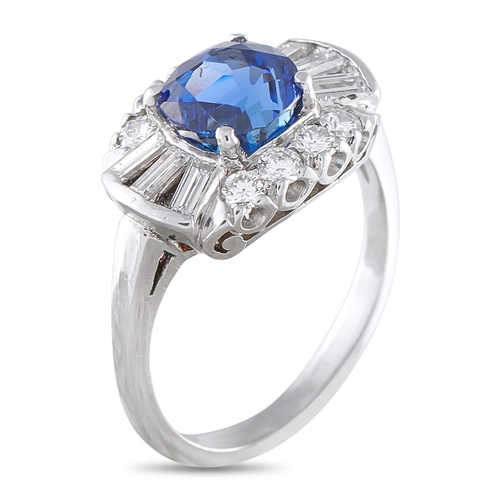 261 - A  Platinum 0.70ct Diamond and Sapphire Ring. Platinum setting is elevated by a stunning 1.85 carat ... 
