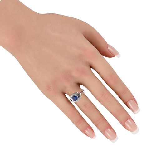261 - A  Platinum 0.70ct Diamond and Sapphire Ring. Platinum setting is elevated by a stunning 1.85 carat ... 