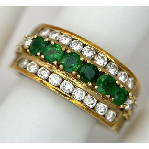 167 - An 18K Yellow Gold Emerald and Diamond Cocktail Ring. 0.30ctw of round cut emeralds between c.1ctw o... 