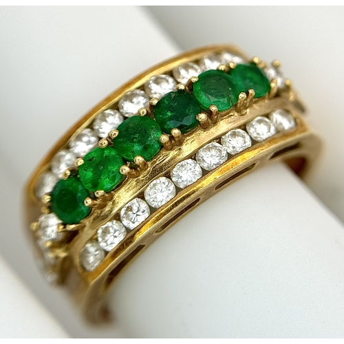 167 - An 18K Yellow Gold Emerald and Diamond Cocktail Ring. 0.30ctw of round cut emeralds between c.1ctw o... 