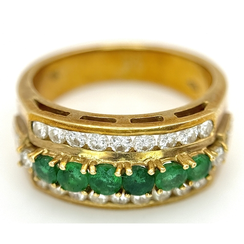 167 - An 18K Yellow Gold Emerald and Diamond Cocktail Ring. 0.30ctw of round cut emeralds between c.1ctw o... 