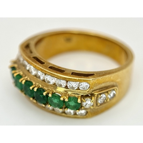167 - An 18K Yellow Gold Emerald and Diamond Cocktail Ring. 0.30ctw of round cut emeralds between c.1ctw o... 