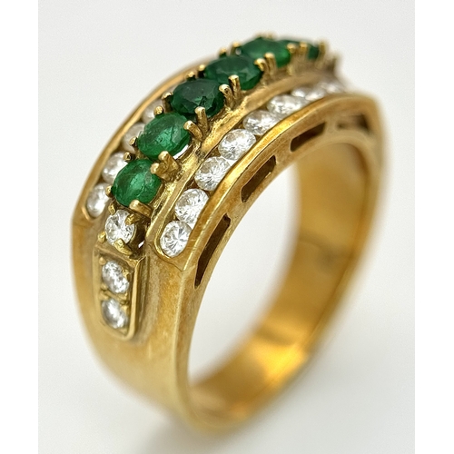 167 - An 18K Yellow Gold Emerald and Diamond Cocktail Ring. 0.30ctw of round cut emeralds between c.1ctw o... 