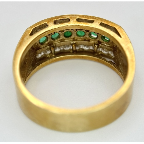 167 - An 18K Yellow Gold Emerald and Diamond Cocktail Ring. 0.30ctw of round cut emeralds between c.1ctw o... 