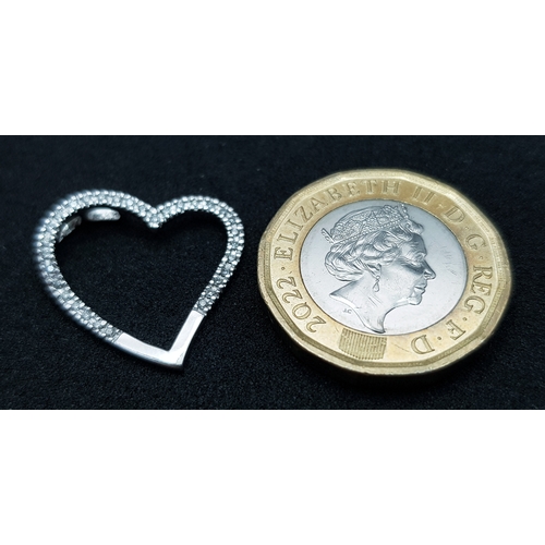 573 - A 9K WHITE GOLD, DIAMOND SET , OPEN HEART PENDANT. 1.2G. SC 1013